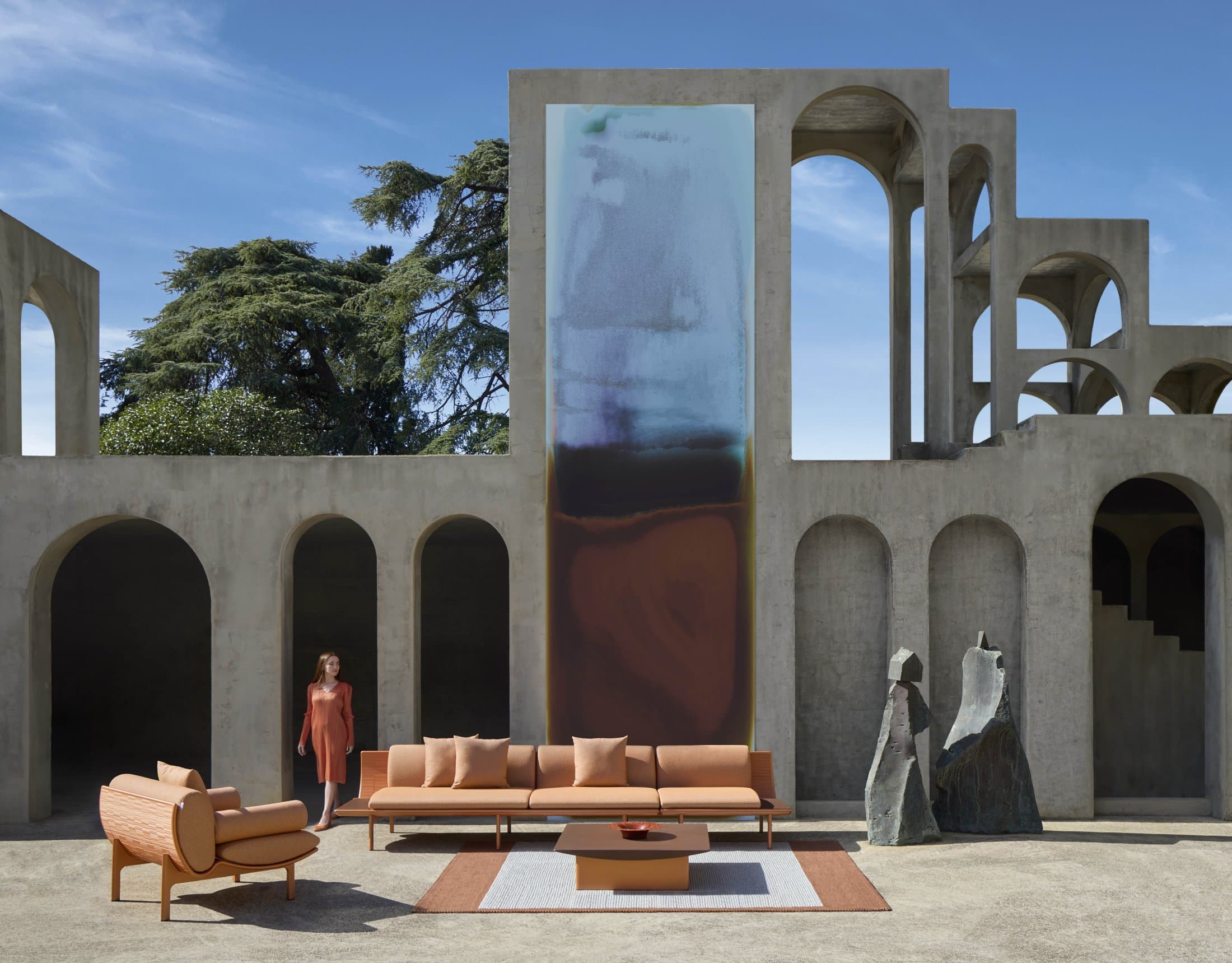 Dunne composition in cuprum in a sculpted stone courtyard.