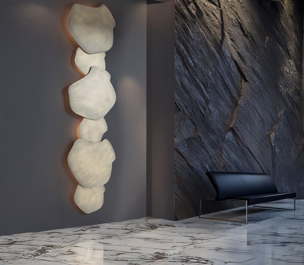 Ya-Ya sculptural wall light on dark marble.