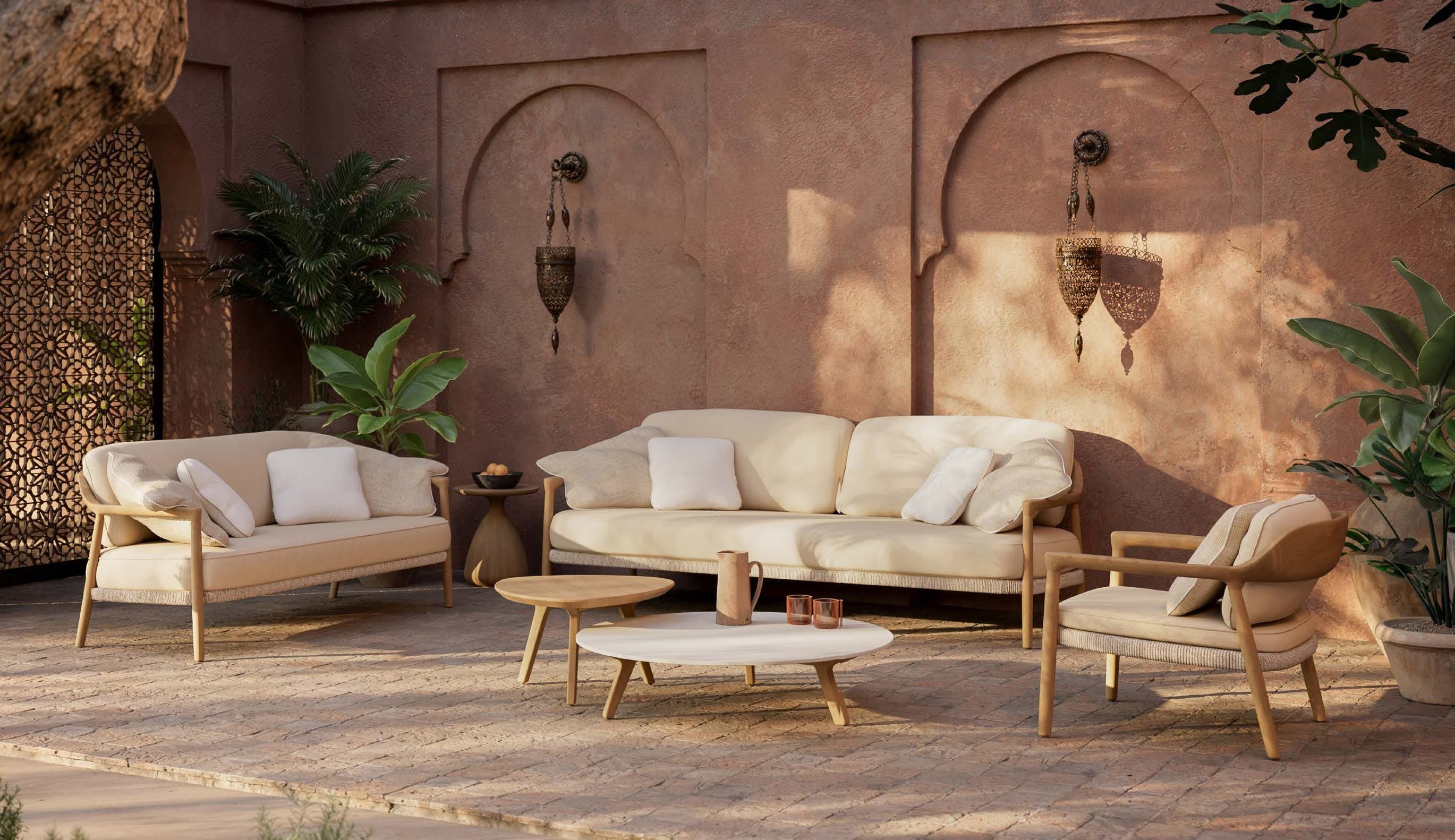 Yiko sofa family with Torsa coffee tables in a shaded court.