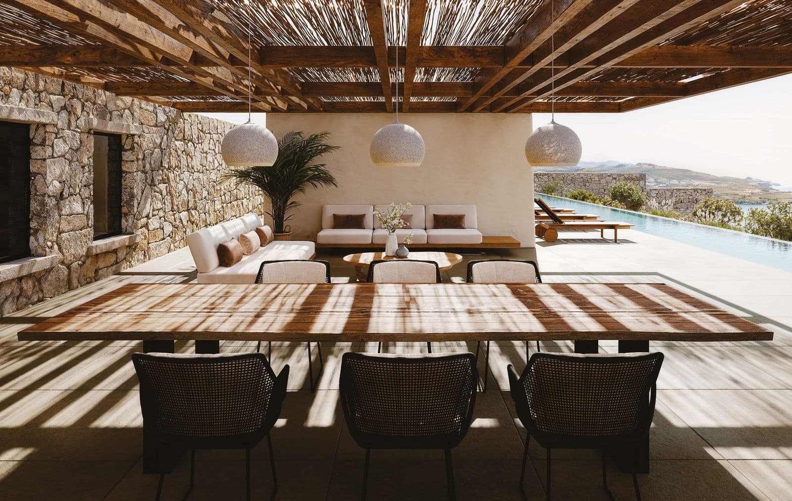 Otranto dining table 350 cm with Esta arm chairs in black.