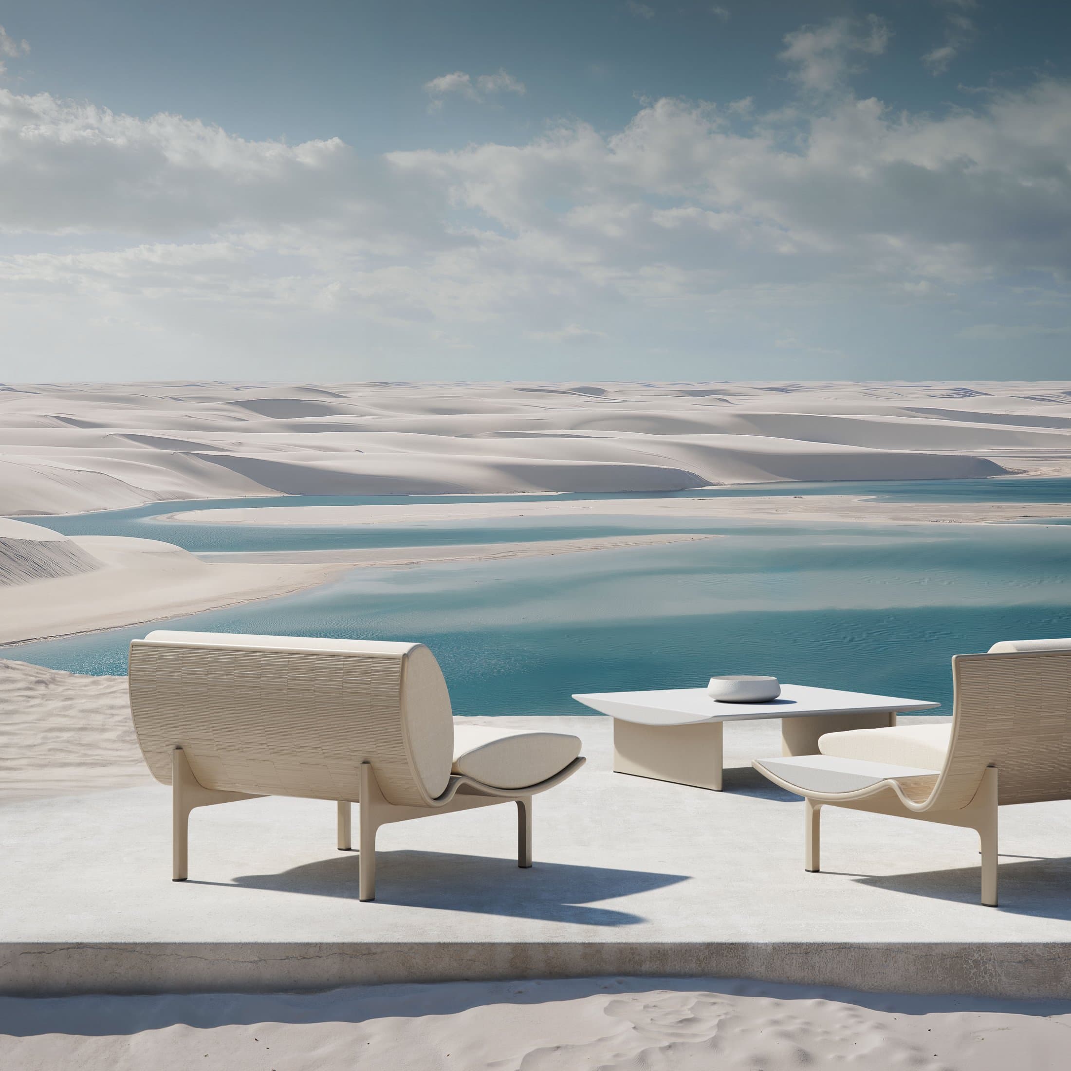 Dunne lounge chairs with a coffee table in gold, dunes and lagoon behind.