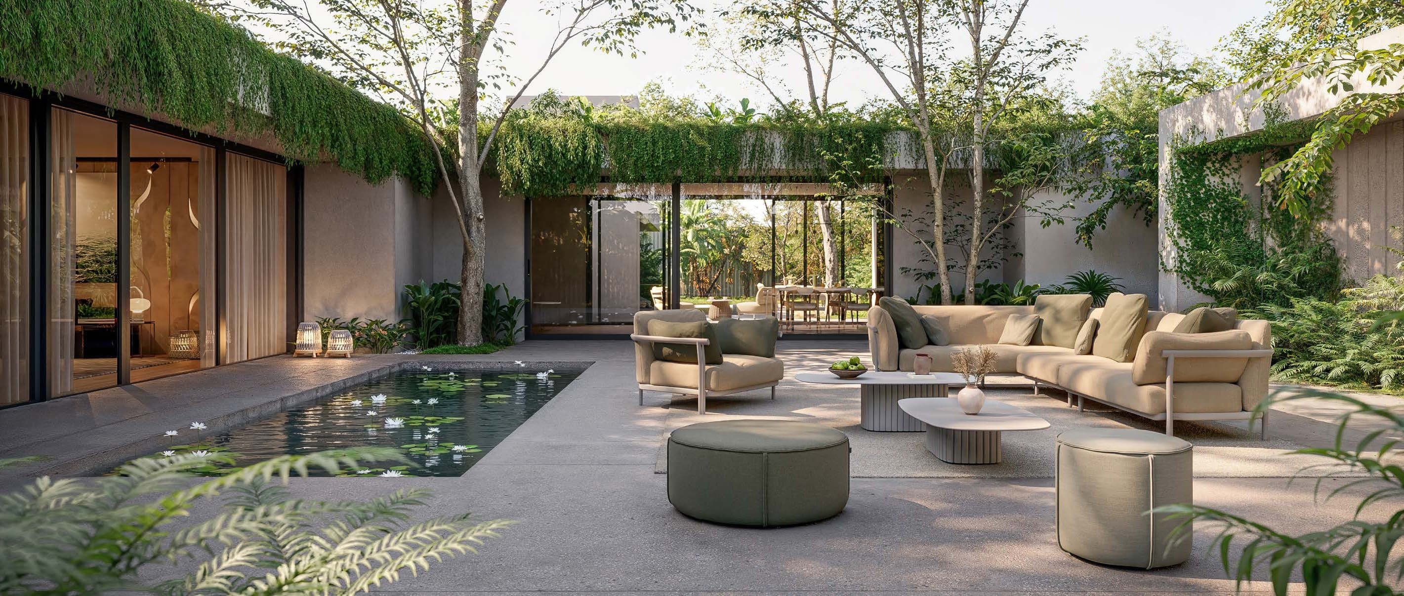 Manutti Nami custom sofa set with Touch poufs in a planted courtyard.