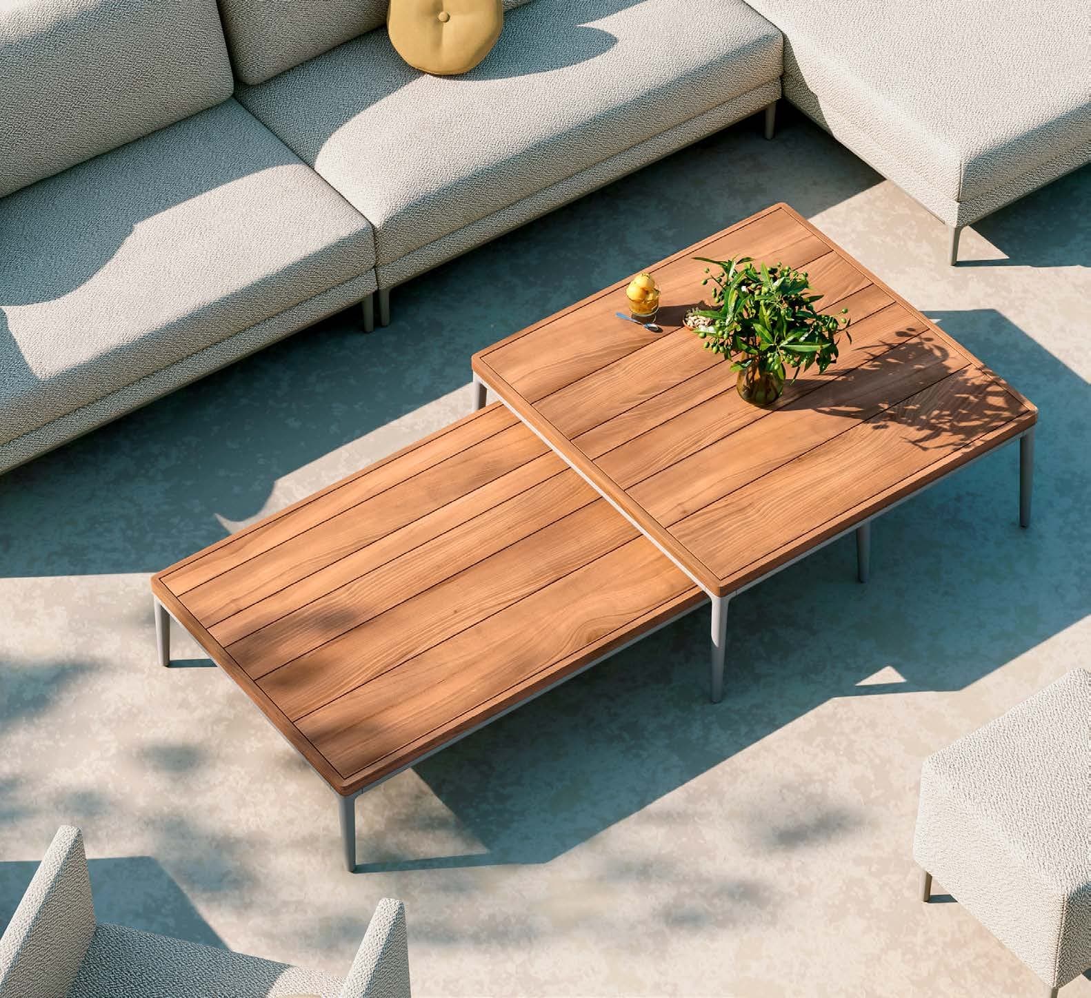 Manutti Zendo Sense coffee table at a pool edge.